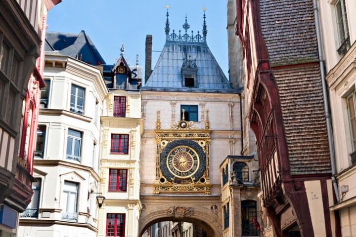 a clock tower in front of a building